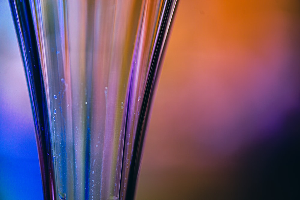 a close up of a glass vase with water in it