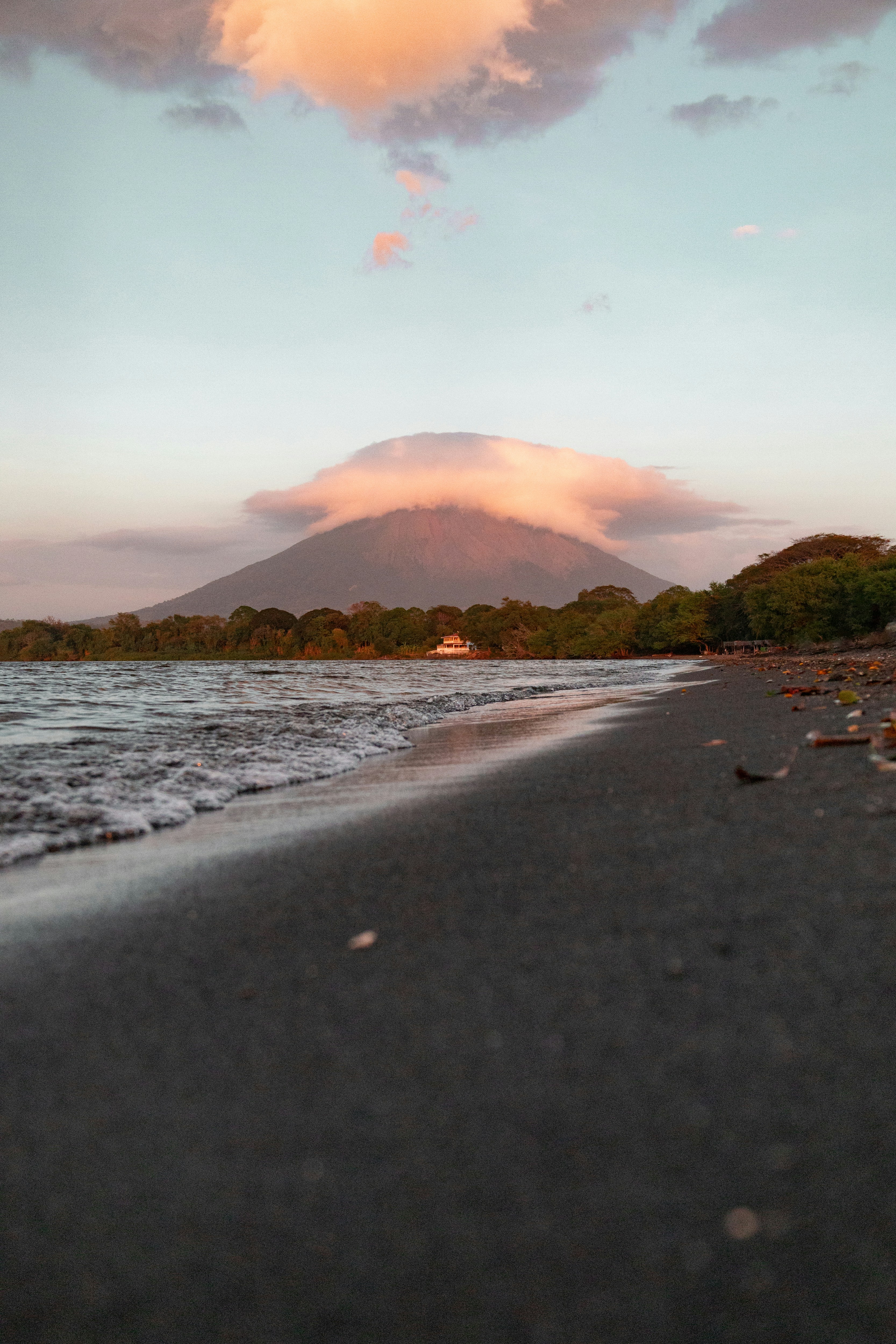 a beach with a mountain in the background