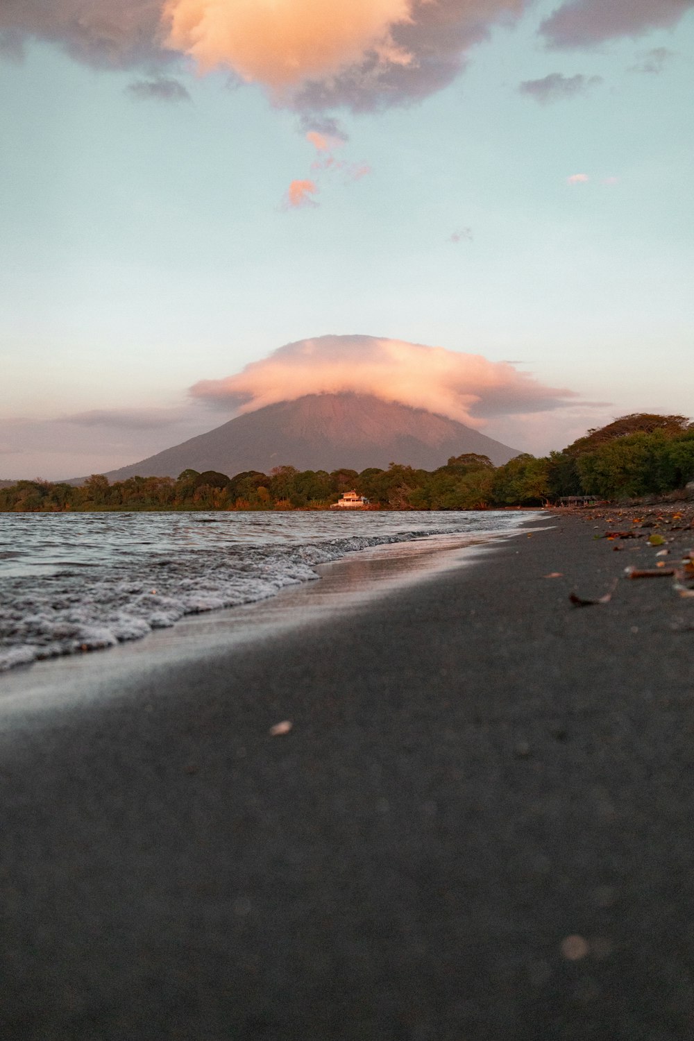 a beach with a mountain in the background