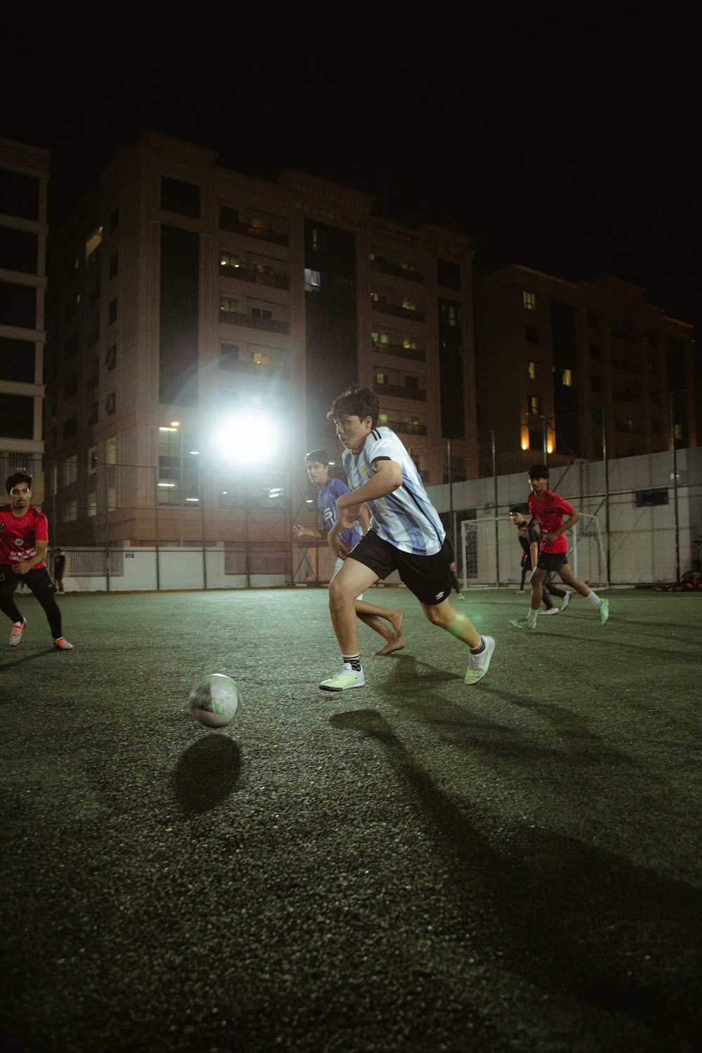 a group of young men playing a game of soccer