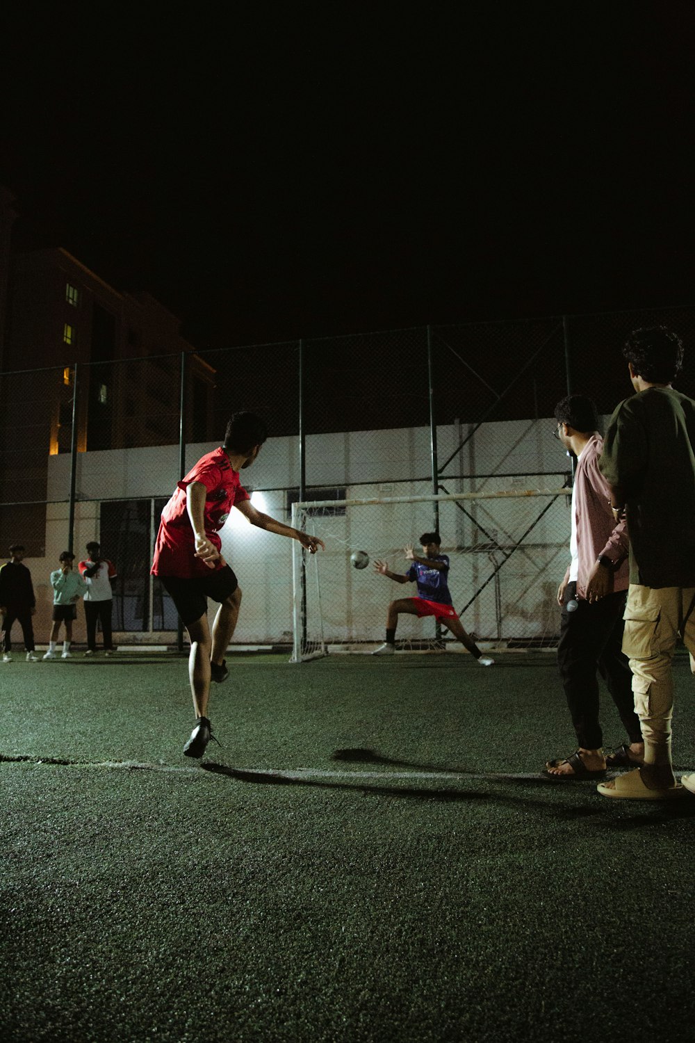 a group of young men playing a game of soccer