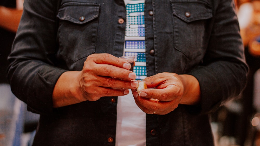 a man holding a cigarette in his hands