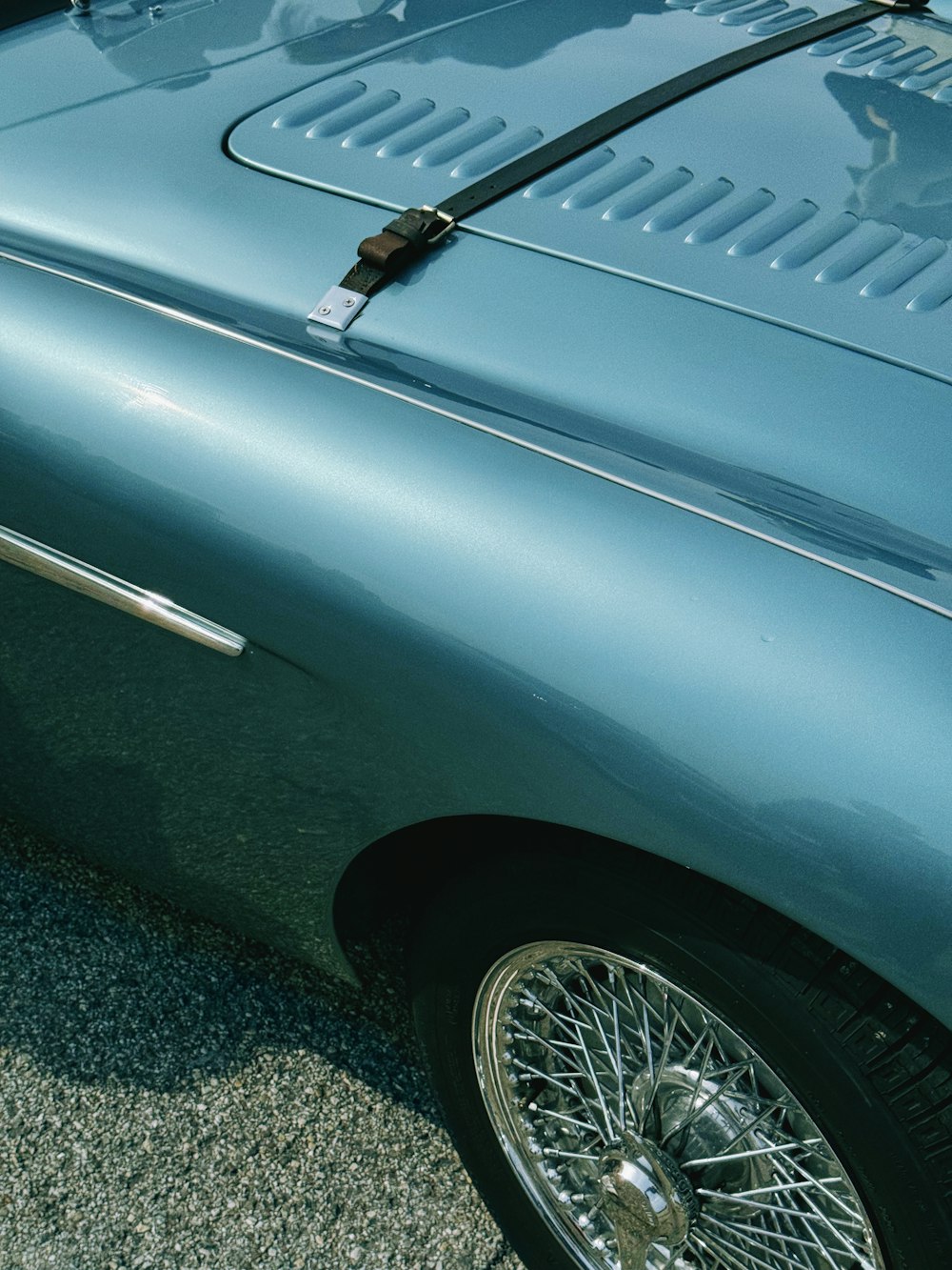 a close up of a car parked on the side of the road