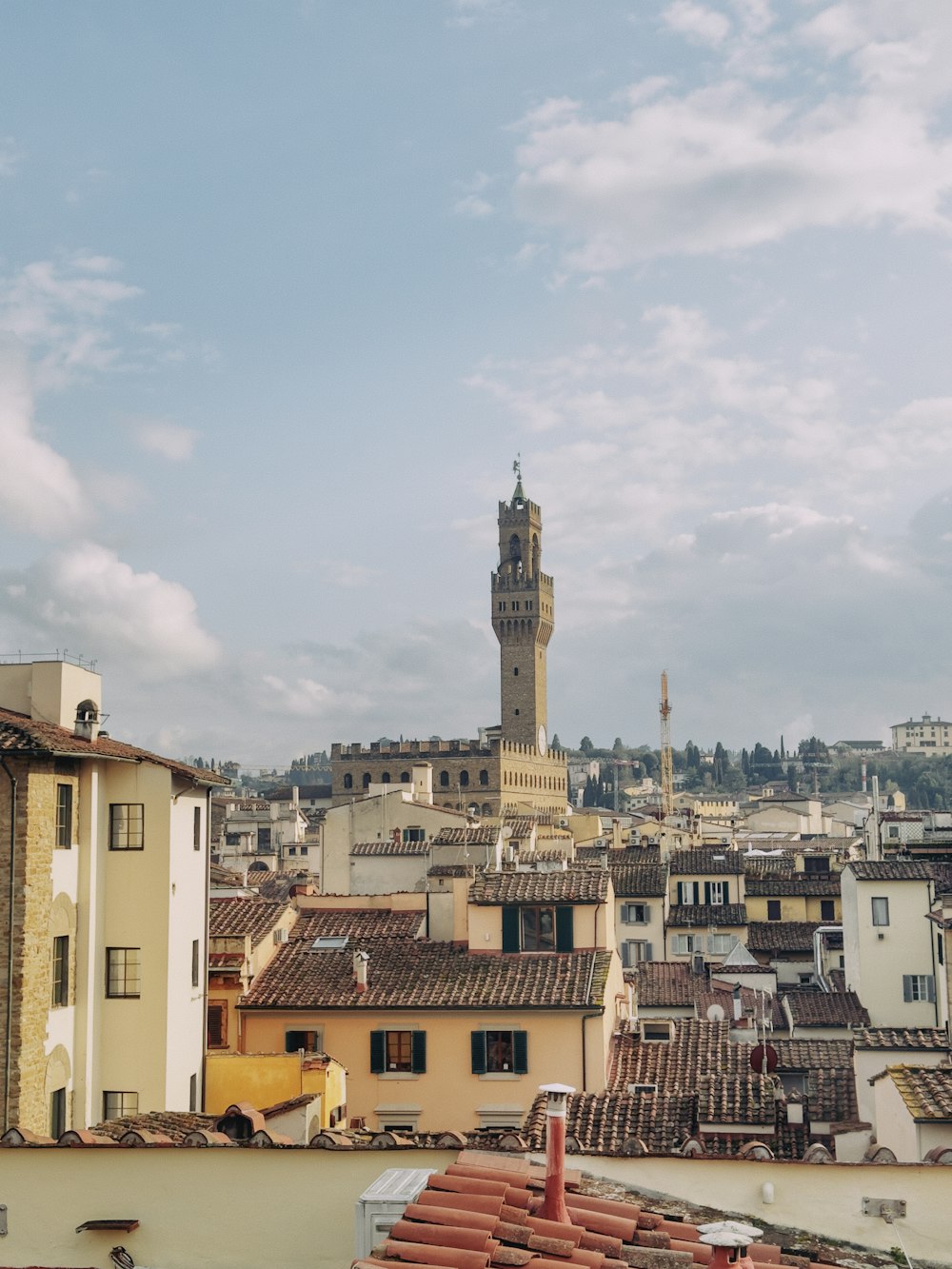 a view of a city with a clock tower in the distance