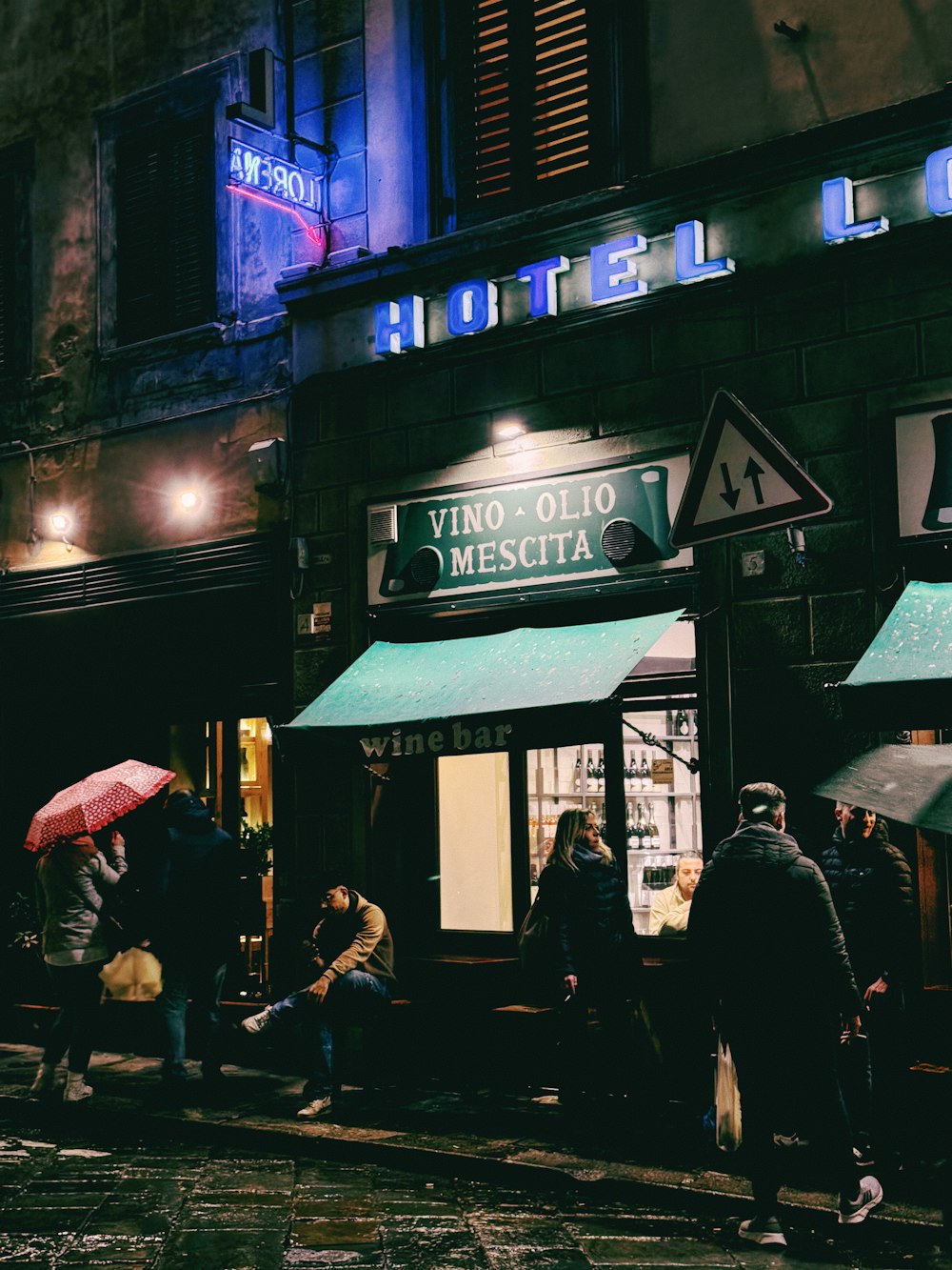 a group of people standing outside of a building