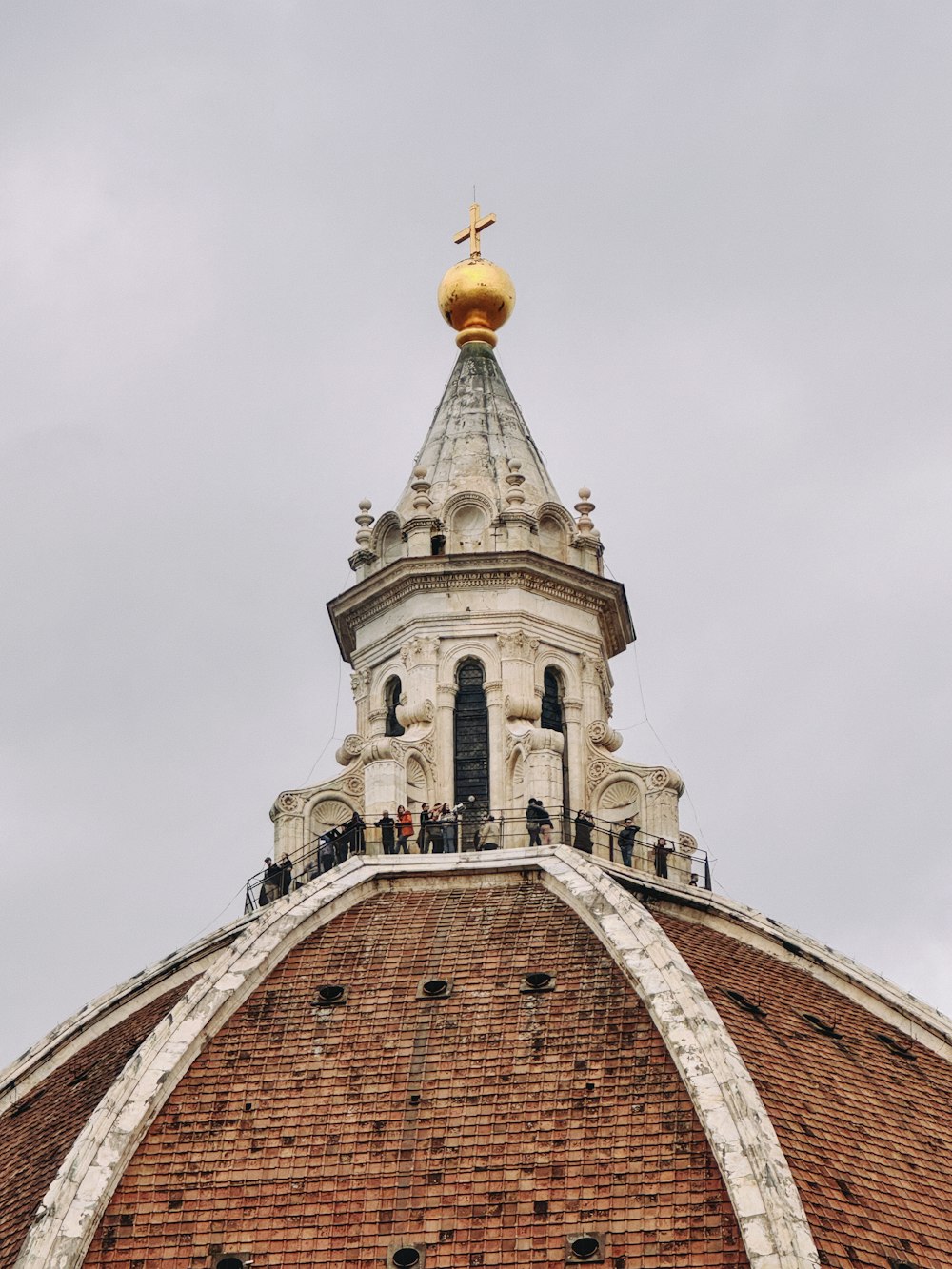 the top of a building with a gold dome