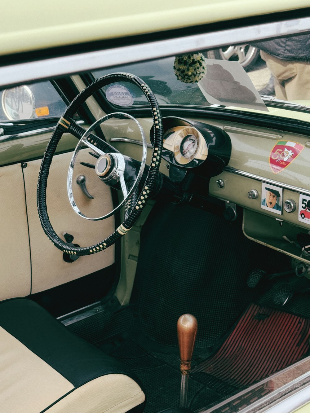 the interior of a car with a steering wheel and dashboard