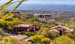a house on a hill with a view of the city