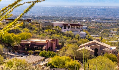 a house on a hill with a view of the city