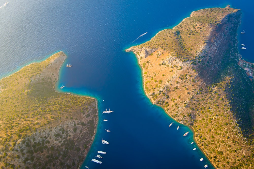 an aerial view of a body of water surrounded by land