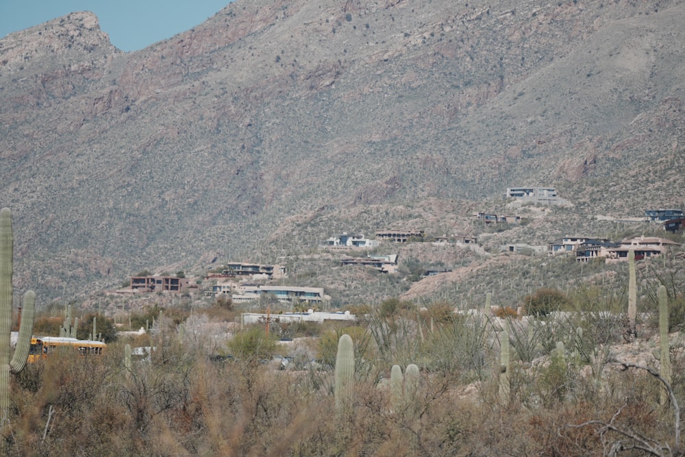 a view of a mountain range with a school bus in the foreground