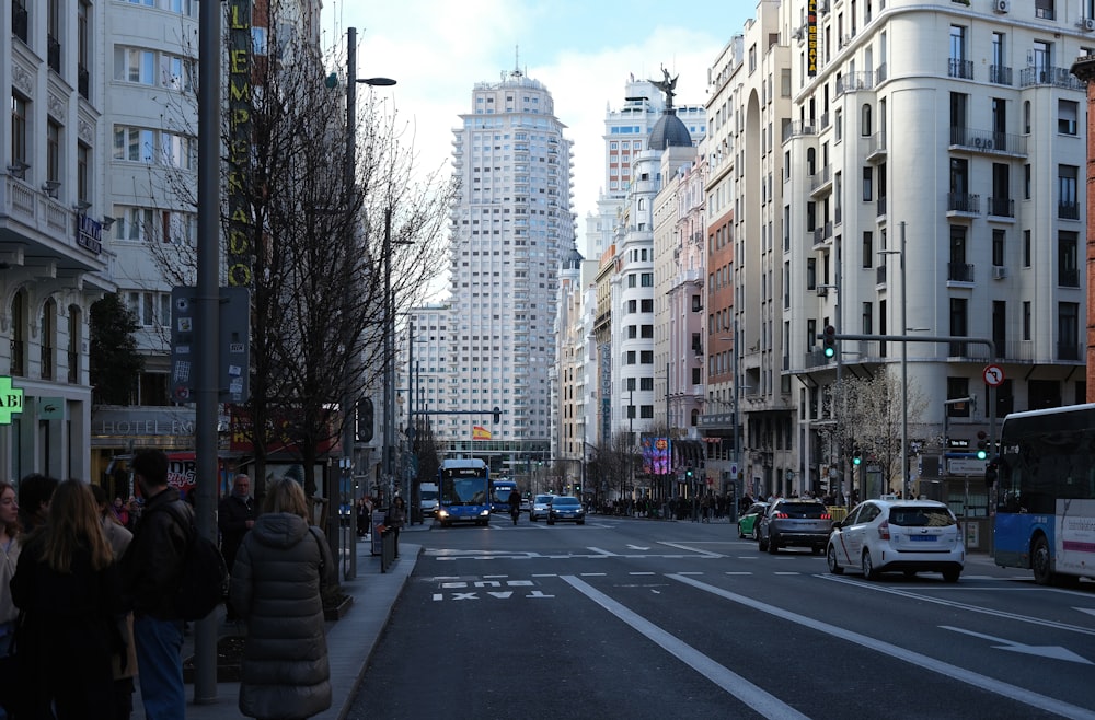 a city street filled with lots of tall buildings