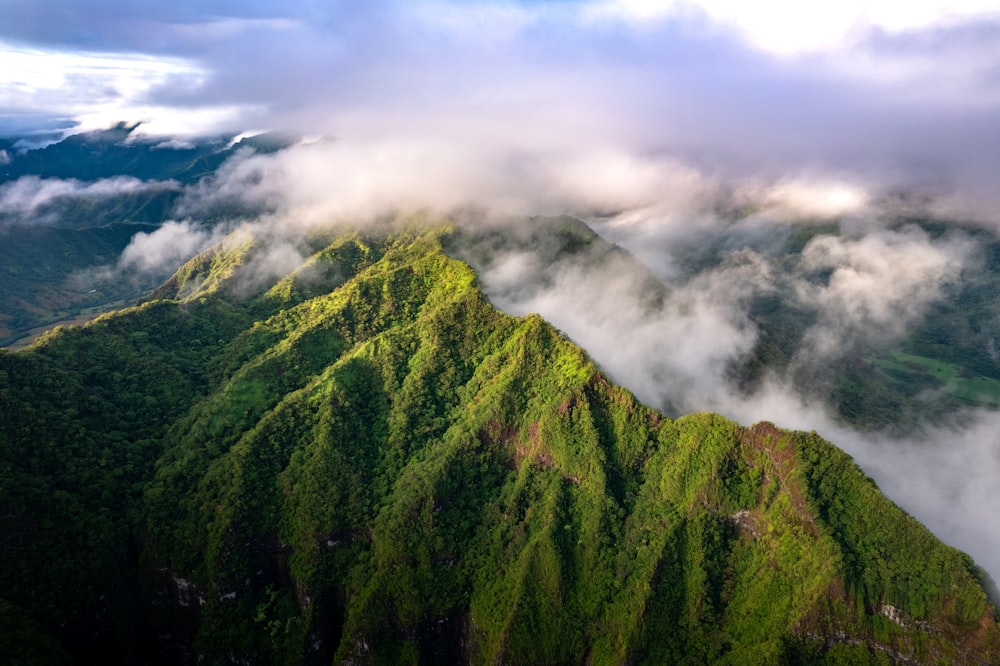 an aerial view of a green mountain range