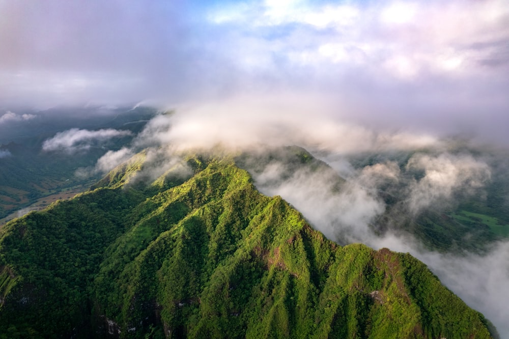 an aerial view of a green mountain range