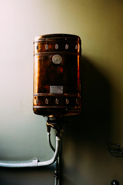 a brown suitcase sitting on top of a metal pole
