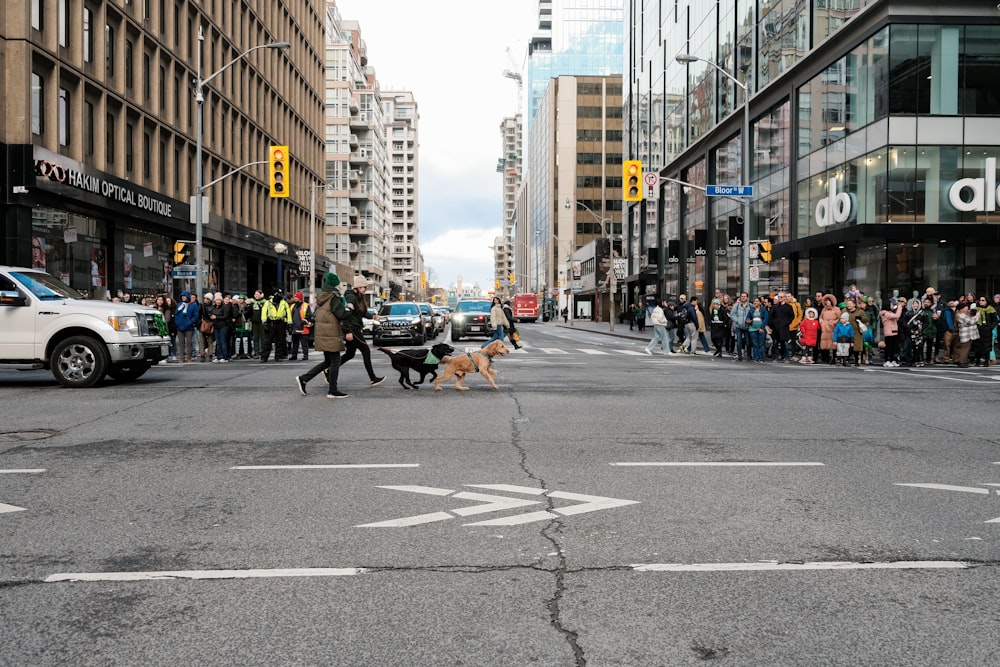 a group of people standing on the side of a road