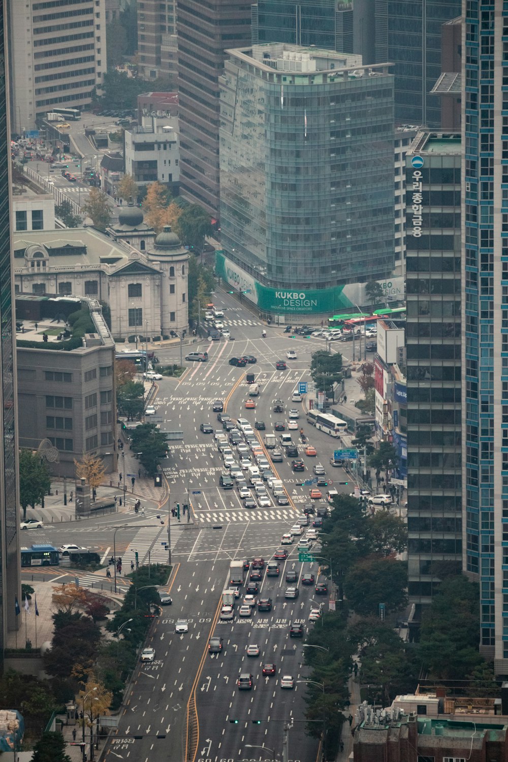 an aerial view of a city with tall buildings