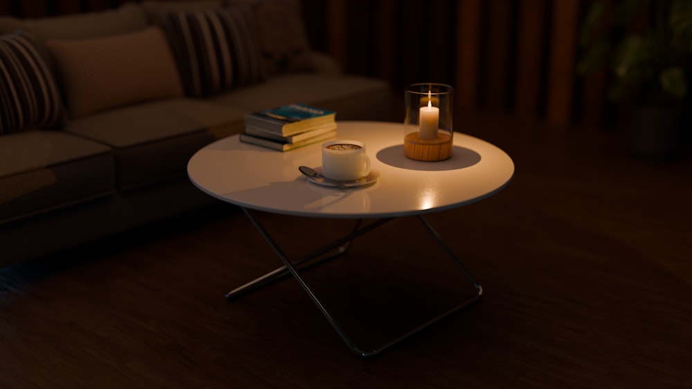 a table with a candle and some books on it