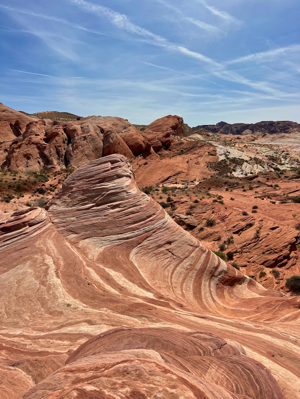 a large rock formation in the middle of a desert