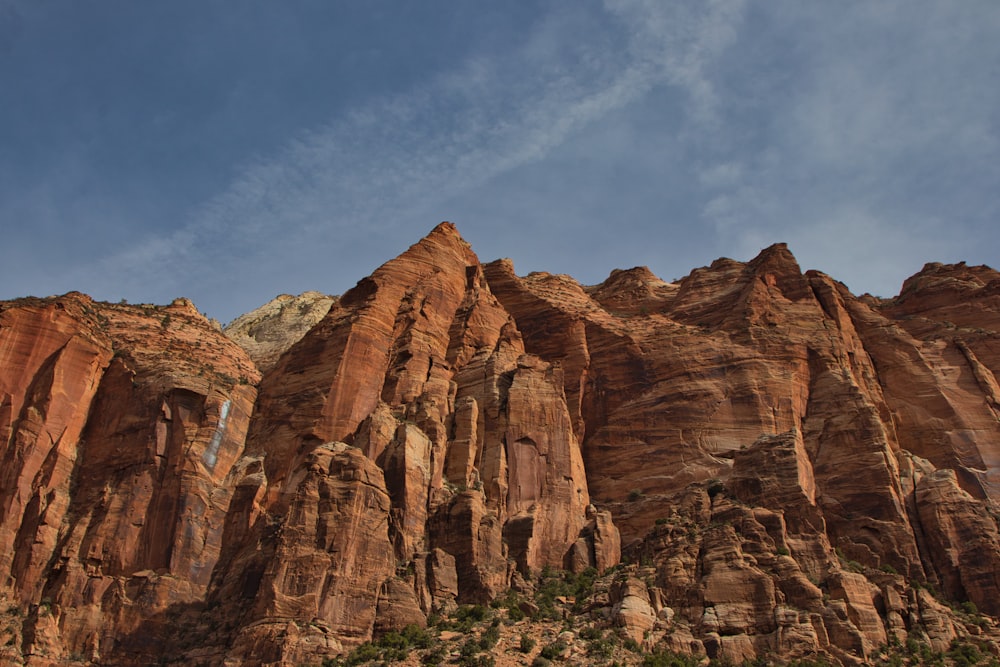 a large mountain with a sky background