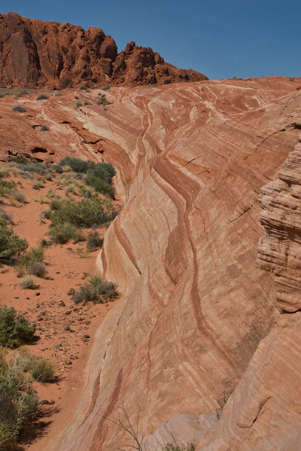 a large rock formation in the middle of a desert