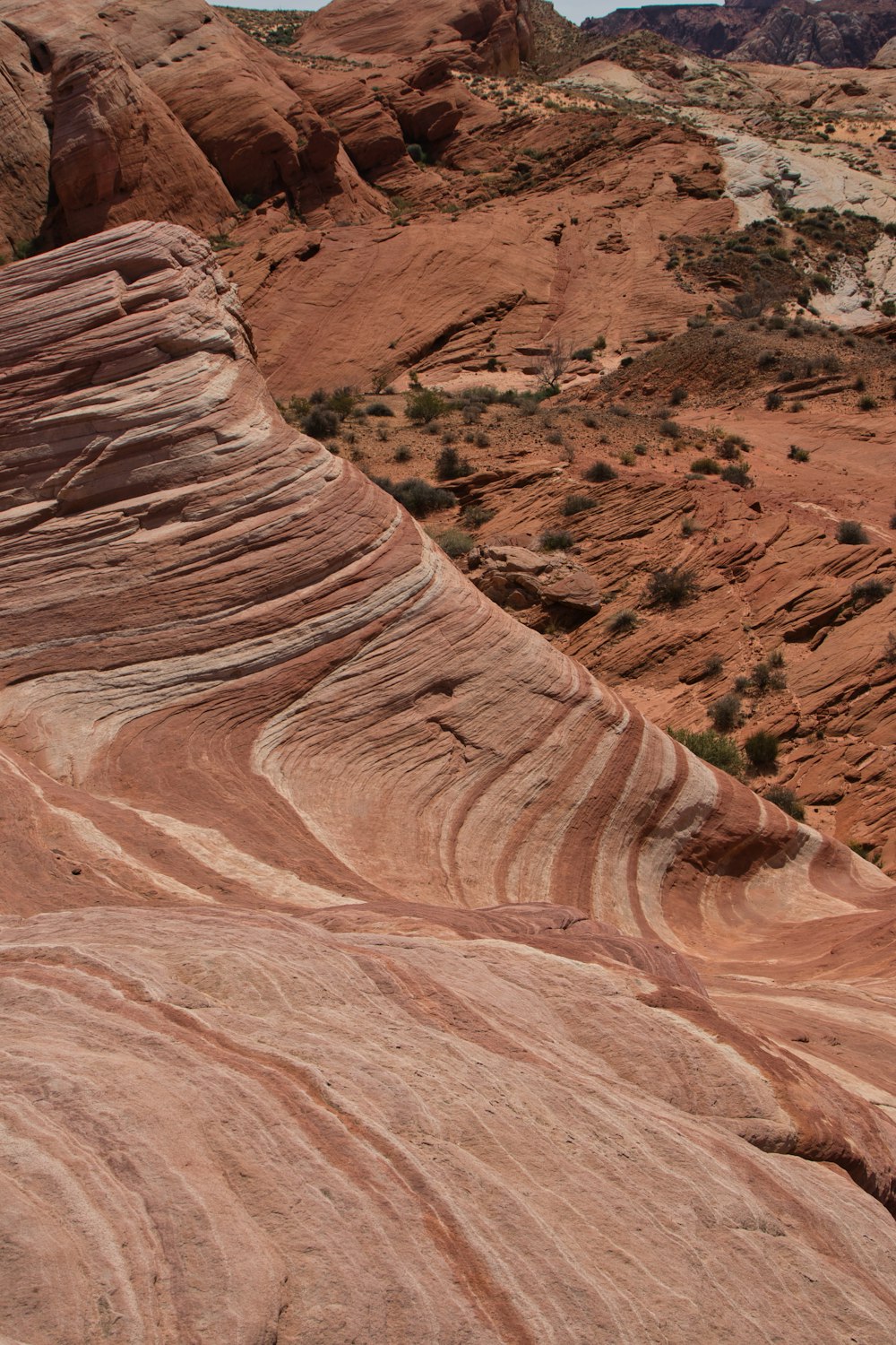 a large rock formation in the middle of a desert