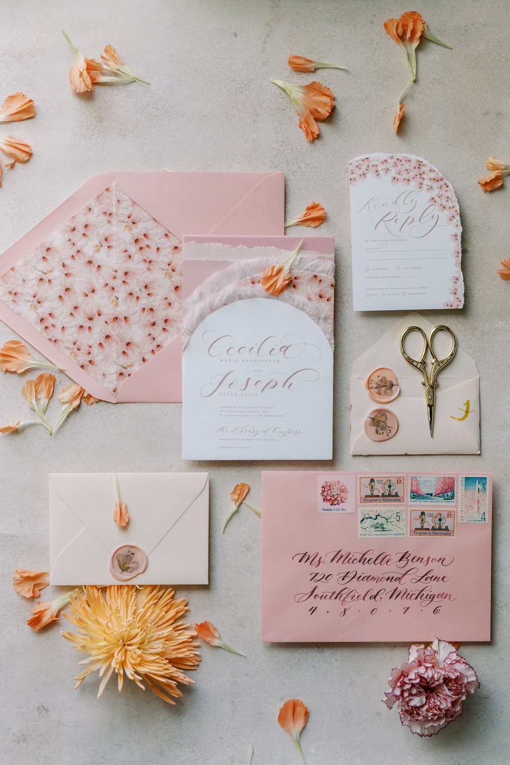 a bunch of different types of wedding stationery on a table