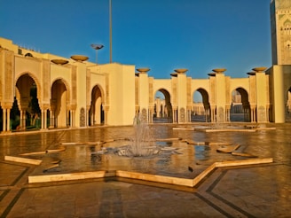 a fountain in the middle of a courtyard