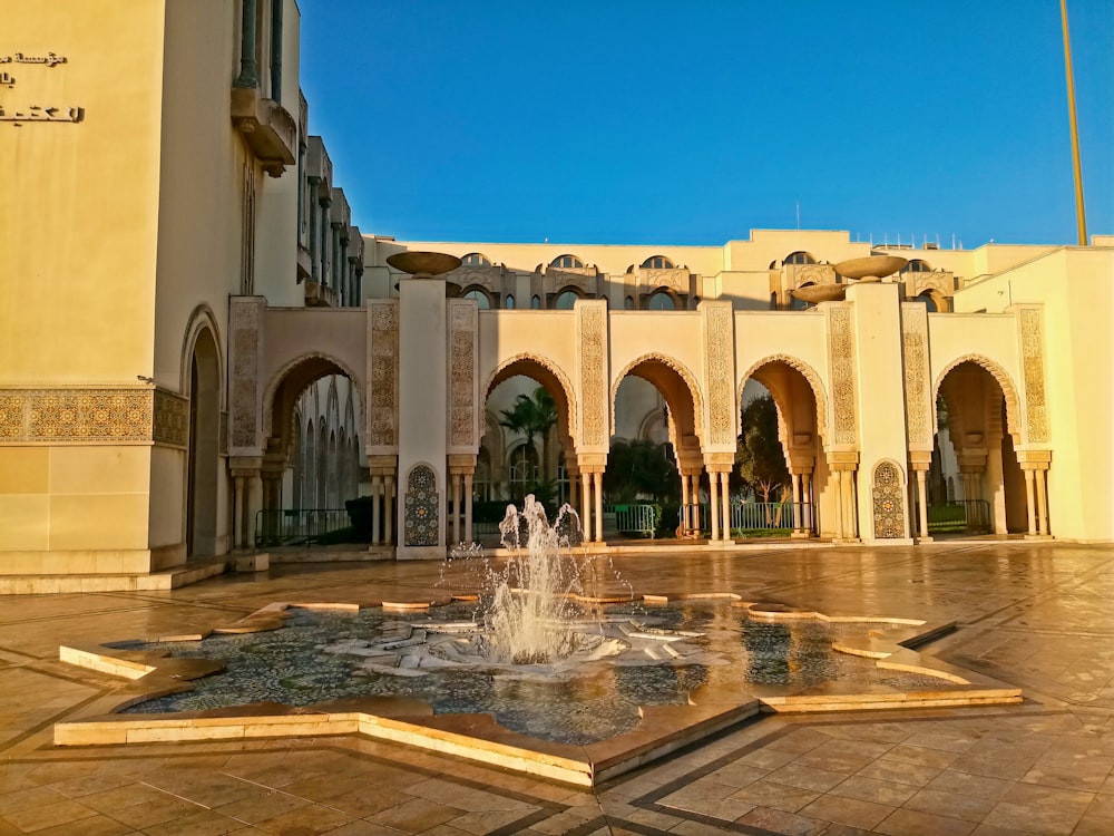 a fountain in the middle of a courtyard