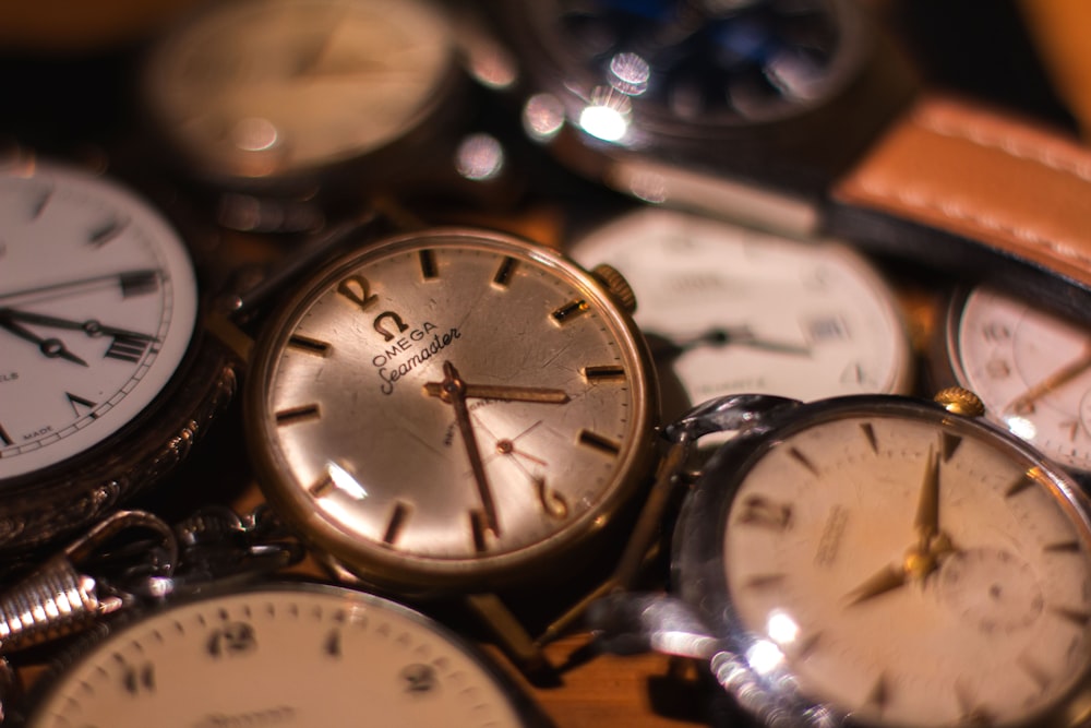 a bunch of different types of watches on a table
