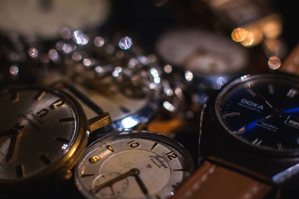 a group of watches sitting on top of a table