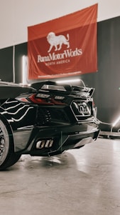 a black sports car parked in a garage