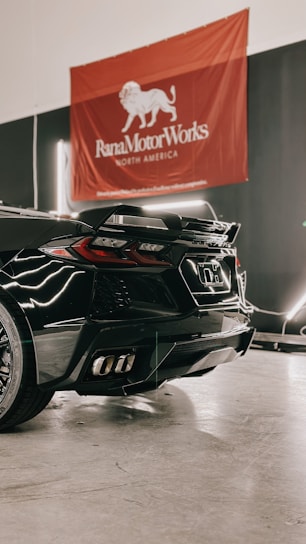 a black sports car parked in a garage