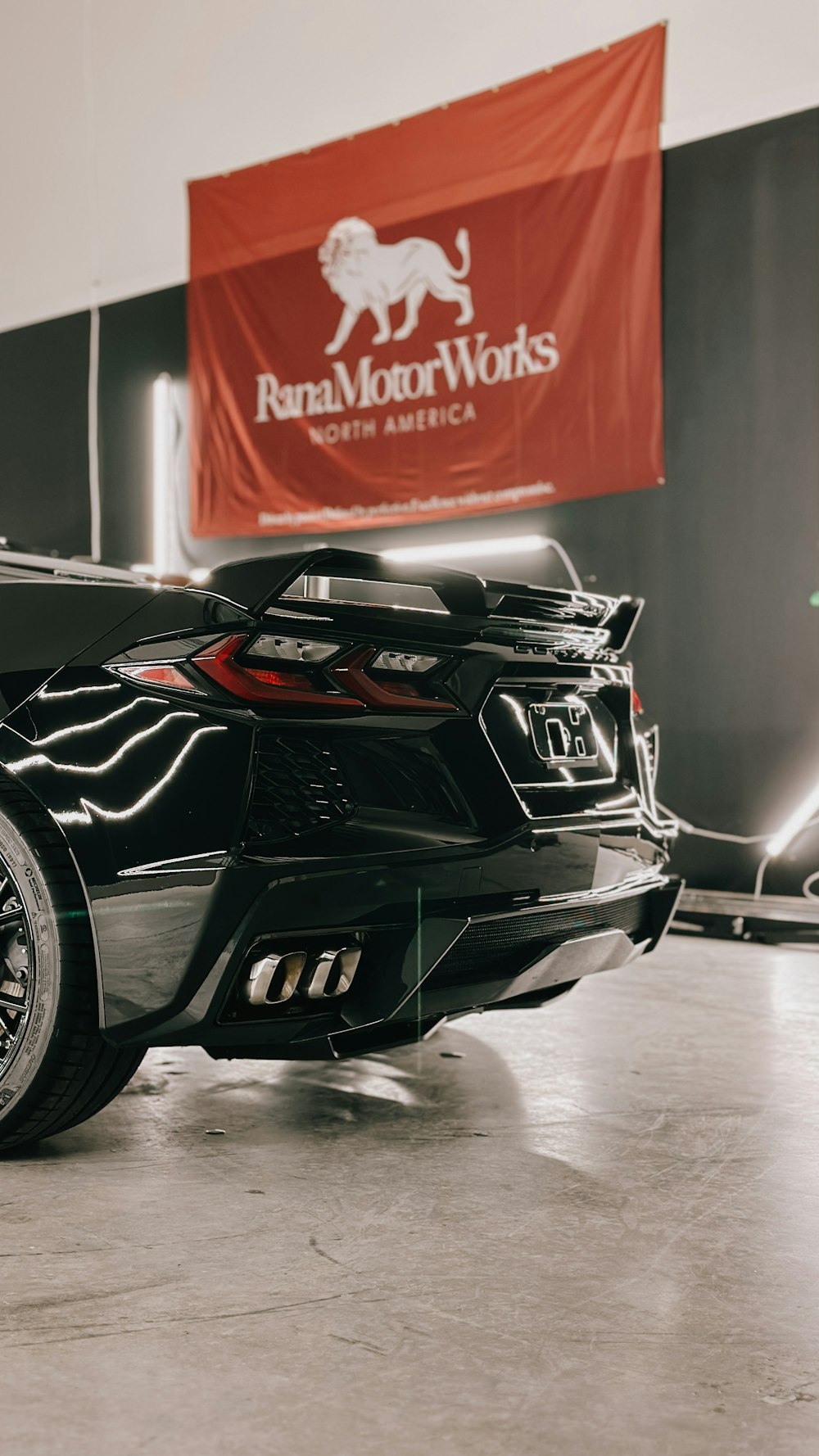 a black sports car parked in a garage