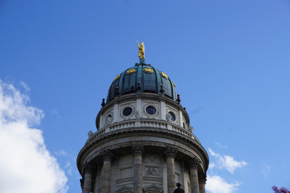 a tall tower with a clock on the top of it