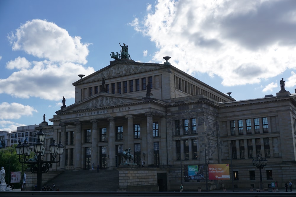 a large building with a statue on top of it