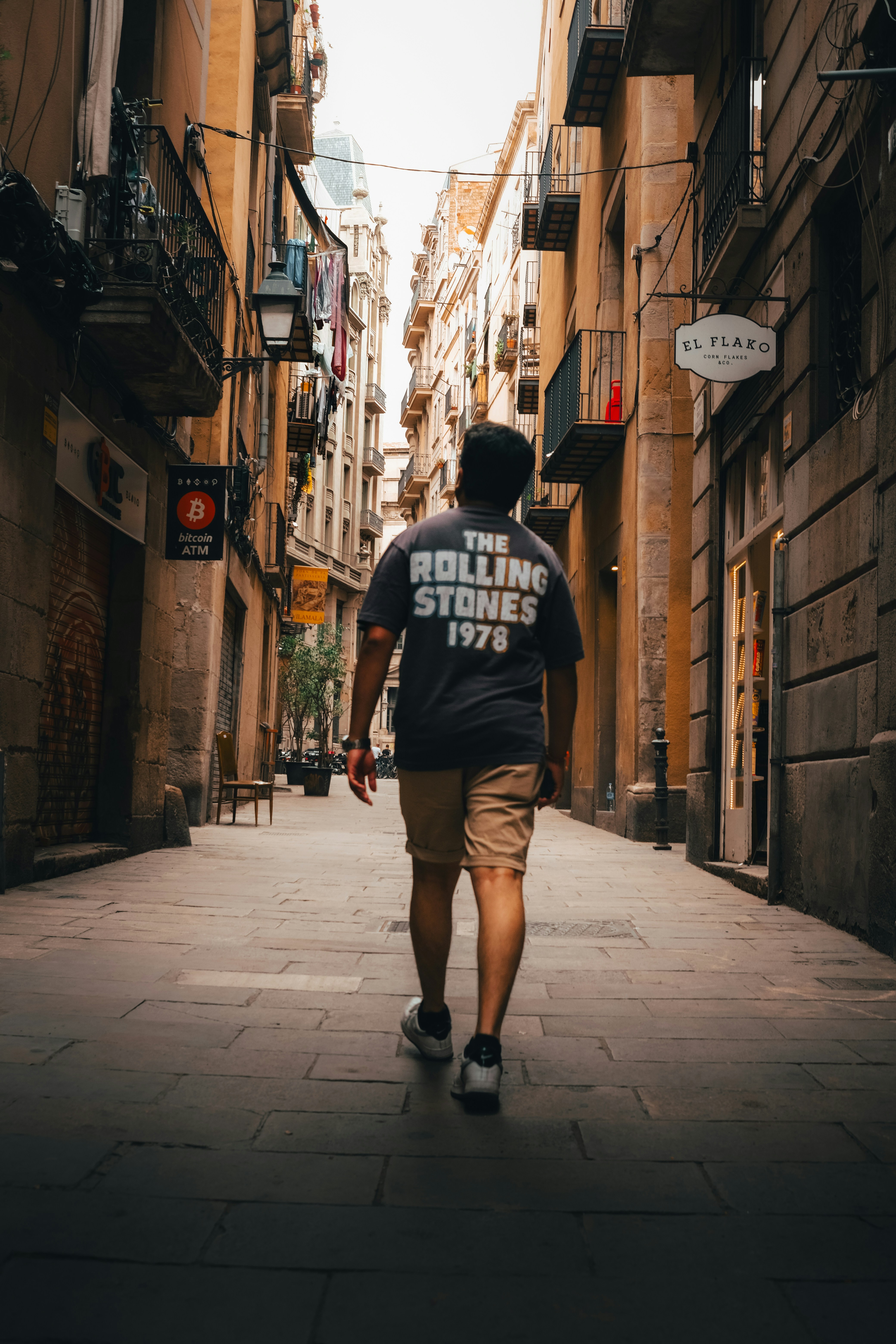 a man walking down a street in a city