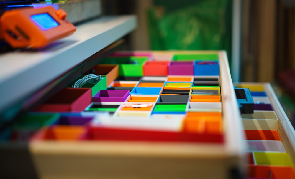 a close up of a multicolored drawer