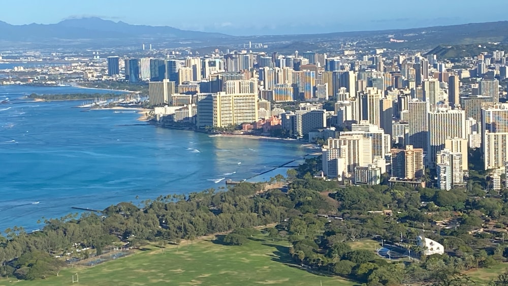 a view of a large city next to a body of water