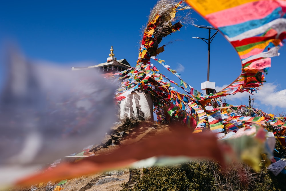 a group of colorful flags blowing in the wind