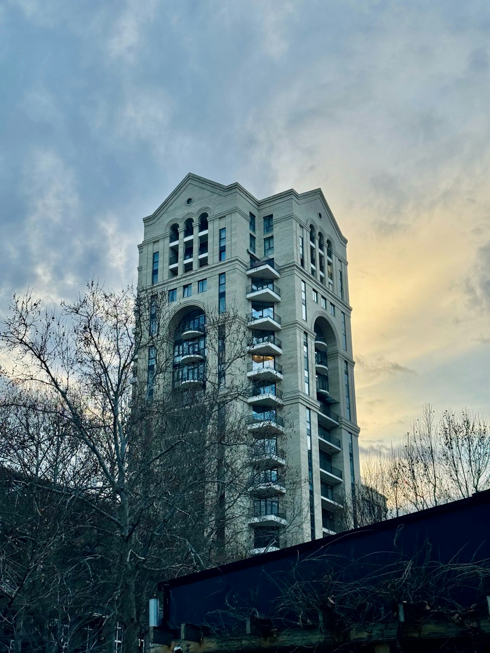 a very tall building with a sky background