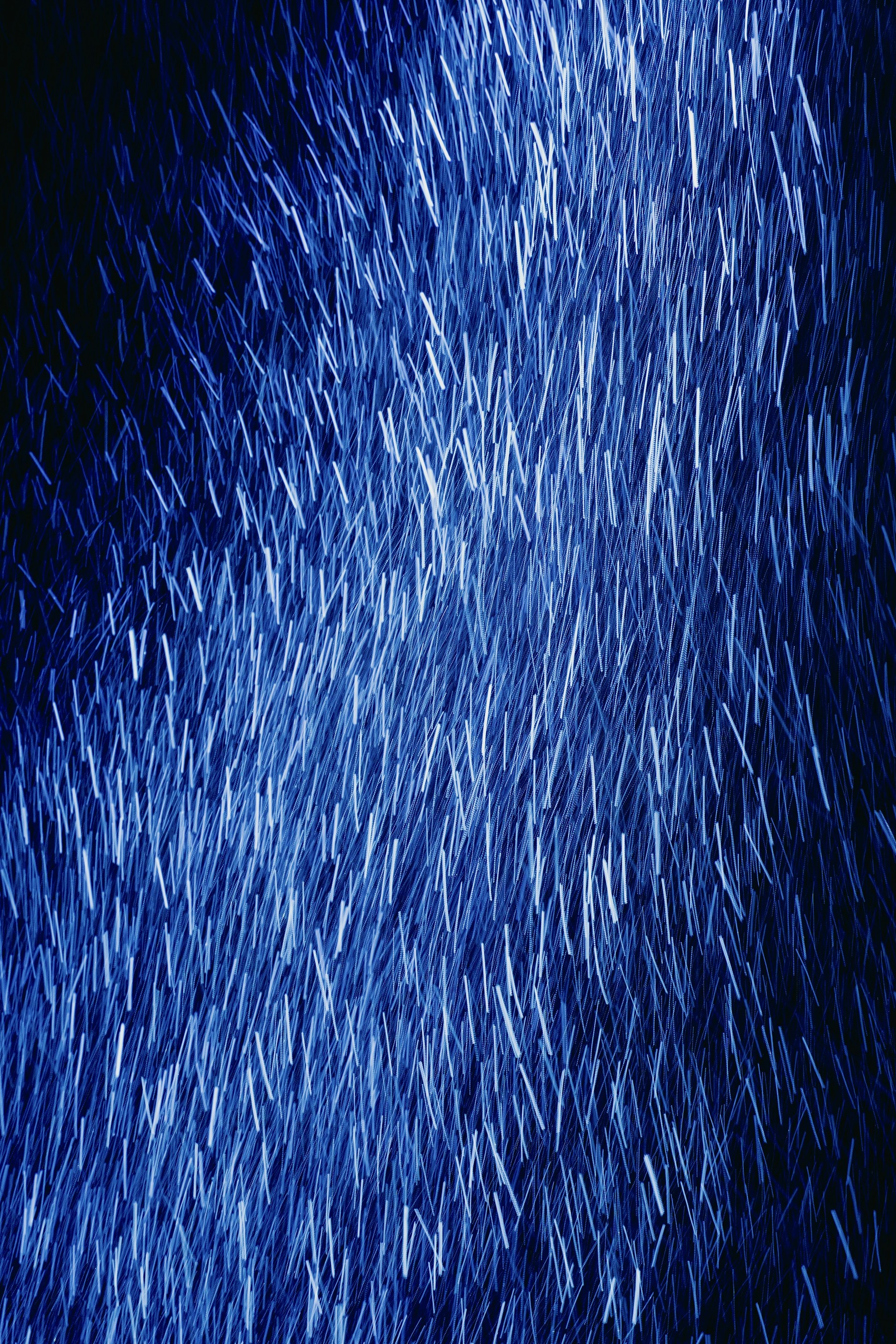 a blue background with a lot of small white dots