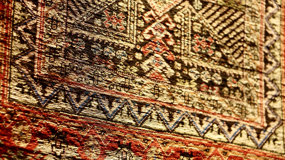 a close up of a rug with a pattern on it