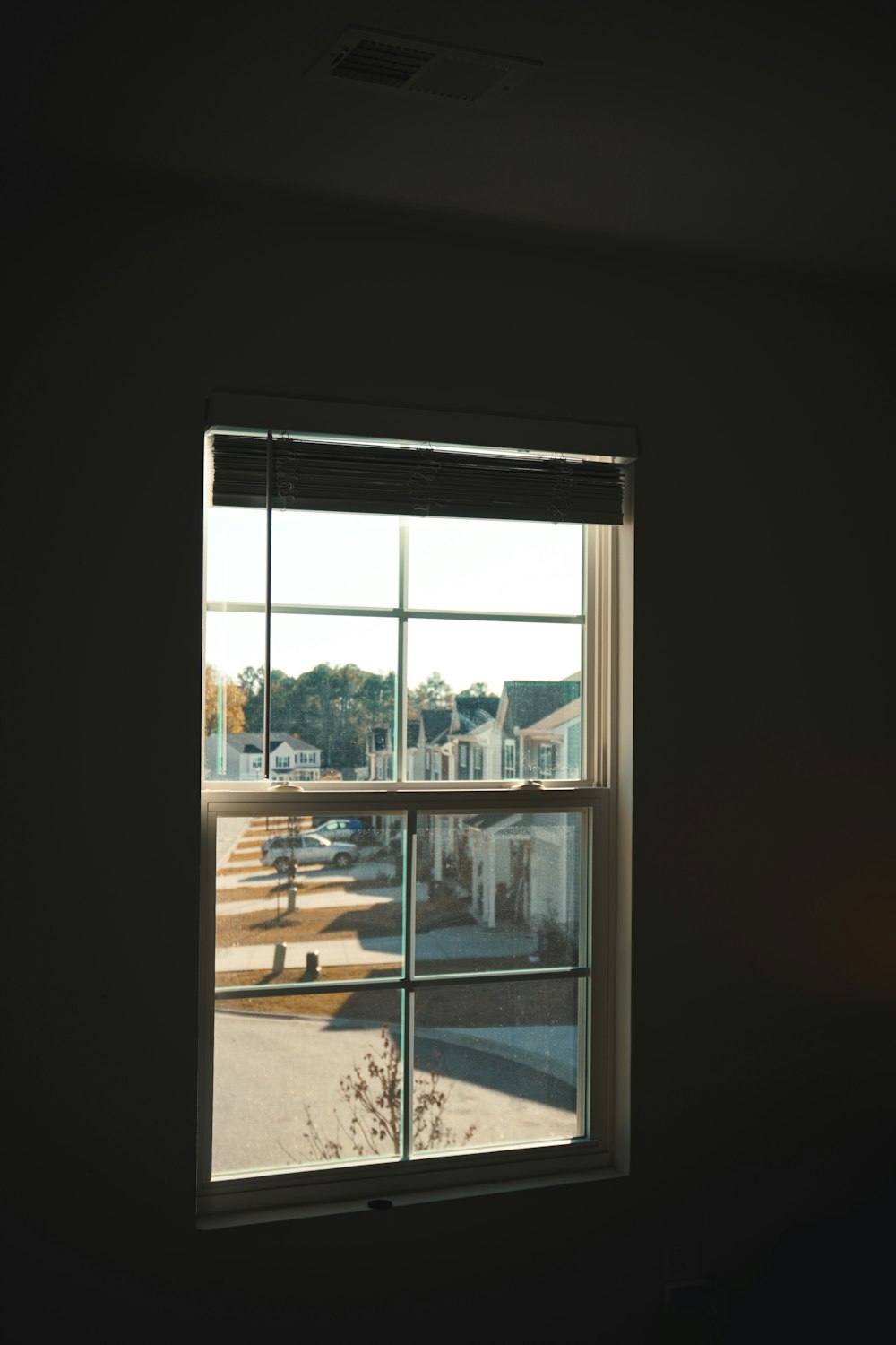 a window with a view of a parking lot