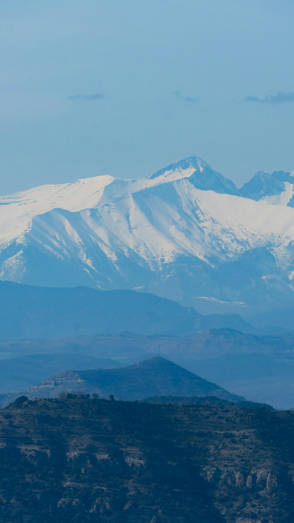 a view of a snow covered mountain range