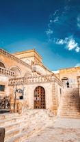a stone building with steps leading up to it