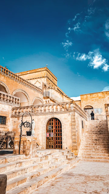 a stone building with steps leading up to it