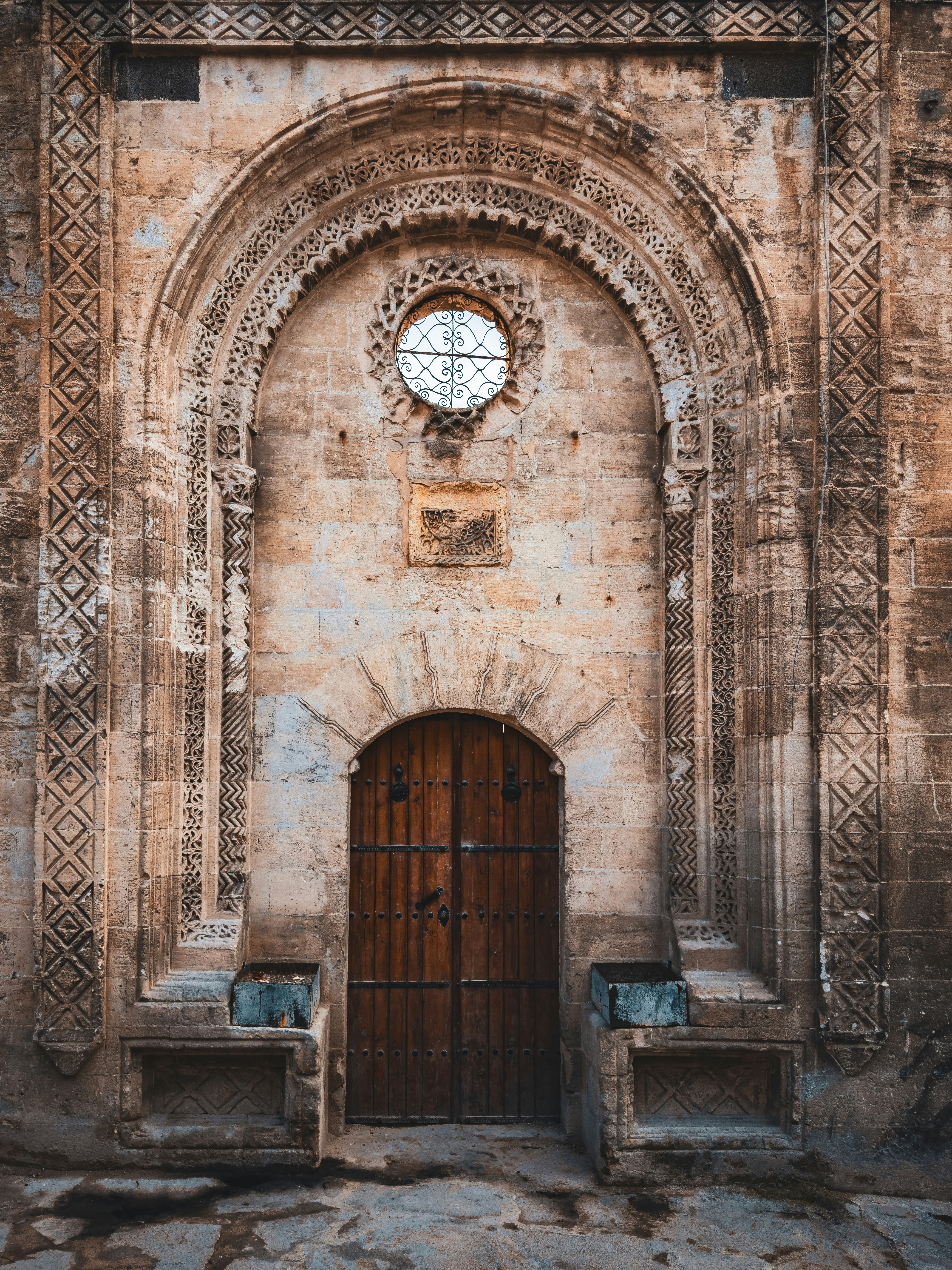 a large stone building with a wooden door