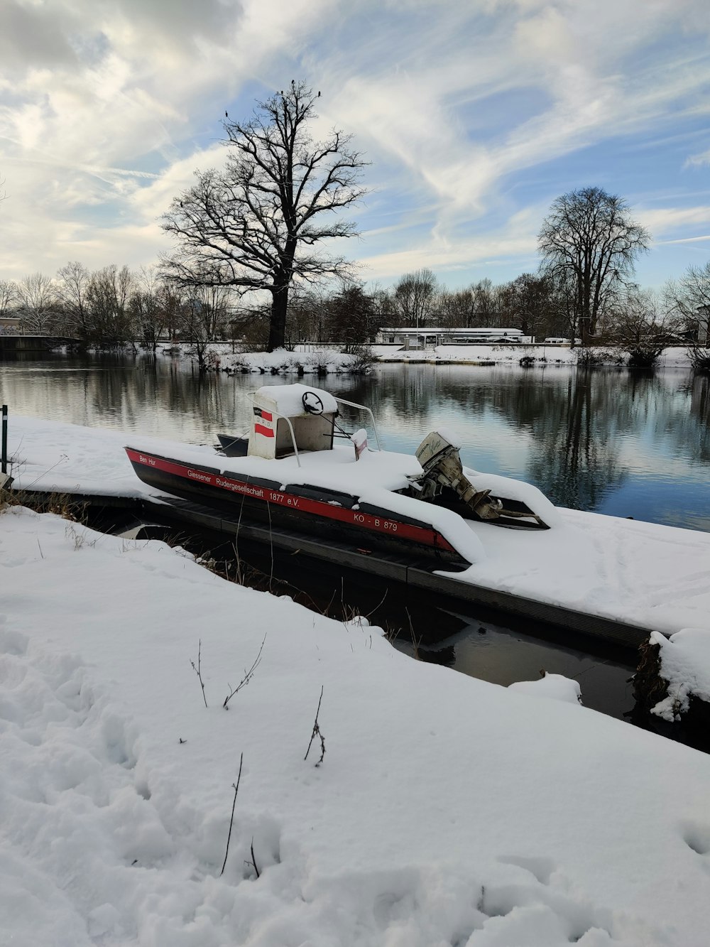 a boat that is sitting in the snow