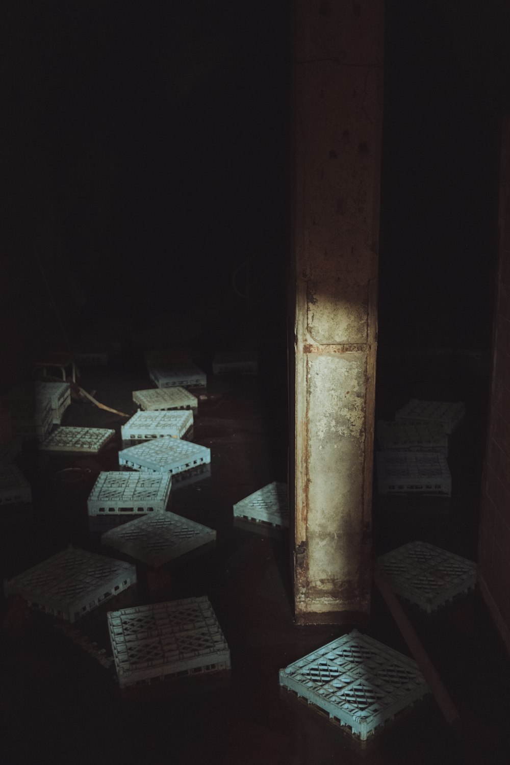 a dark room with a bunch of boxes on the floor